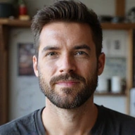 A professional headshot of David Garcia, a man with a thoughtful and creative expression.