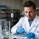 Certified aquarium technician examining water samples